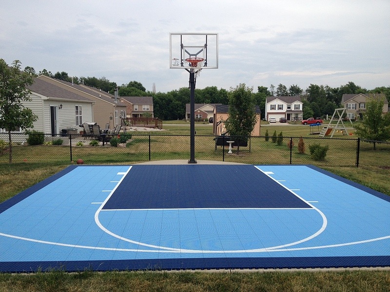 Compact blue outdoor basketball half court reference