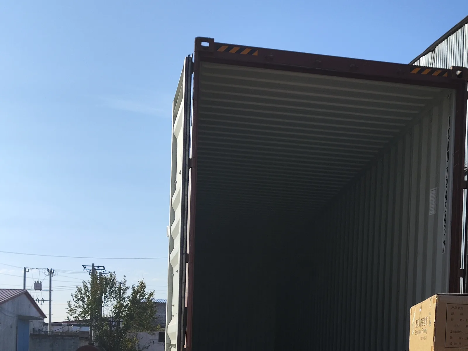 Open shipping container positioned for loading preparation